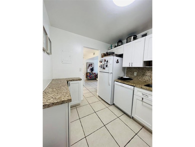 Located in the heart of Emerald Hills, this charming first-floor on The Club at Emerald Hills in Florida - for sale on GolfHomes.com, golf home, golf lot