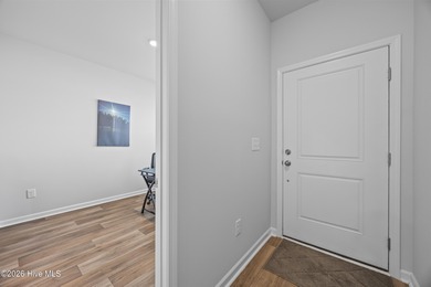 Elegantly appointed resale townhome located in The Hamptons at on Brunswick Plantation and Golf Resorts in North Carolina - for sale on GolfHomes.com, golf home, golf lot