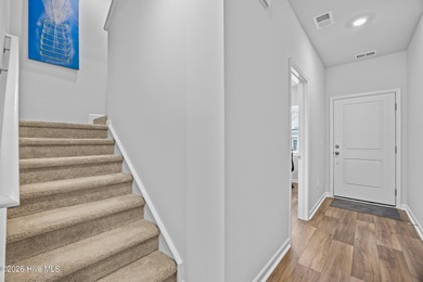 Elegantly appointed resale townhome located in The Hamptons at on Brunswick Plantation and Golf Resorts in North Carolina - for sale on GolfHomes.com, golf home, golf lot