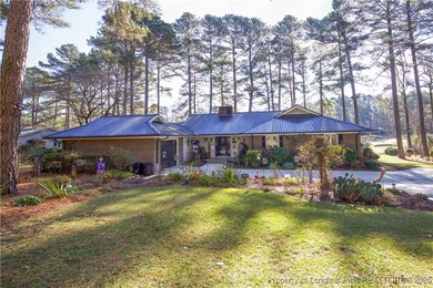 Perfectly positioned on a dog-leg right par five of the Seven on Seven Lakes Country Club in North Carolina - for sale on GolfHomes.com, golf home, golf lot