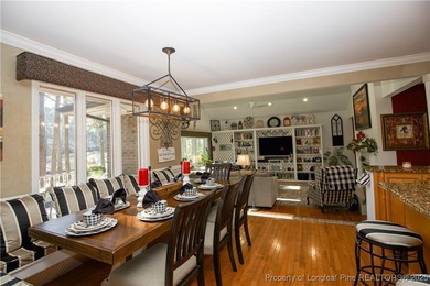 Perfectly positioned on a dog-leg right par five of the Seven on Seven Lakes Country Club in North Carolina - for sale on GolfHomes.com, golf home, golf lot