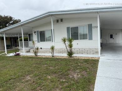 Welcome to this beautifully furnished 2-bedroom, 2-bathroom home on High Point Golf Club, Inc. in Florida - for sale on GolfHomes.com, golf home, golf lot