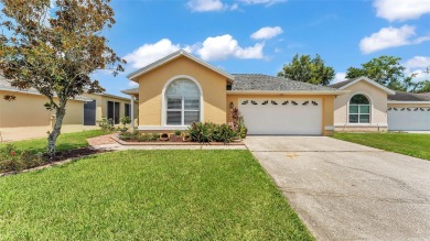 Enjoy peaceful golf course and water views from this 2-bedroom on Imperial Lakes Country Club in Florida - for sale on GolfHomes.com, golf home, golf lot