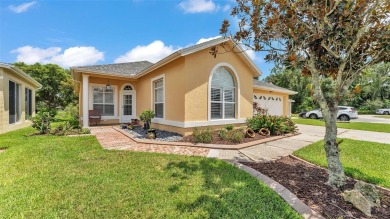Enjoy peaceful golf course and water views from this 2-bedroom on Imperial Lakes Country Club in Florida - for sale on GolfHomes.com, golf home, golf lot