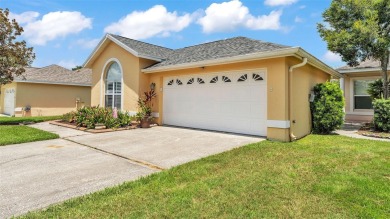Enjoy peaceful golf course and water views from this 2-bedroom on Imperial Lakes Country Club in Florida - for sale on GolfHomes.com, golf home, golf lot