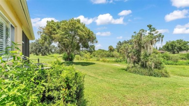 Enjoy peaceful golf course and water views from this 2-bedroom on Imperial Lakes Country Club in Florida - for sale on GolfHomes.com, golf home, golf lot