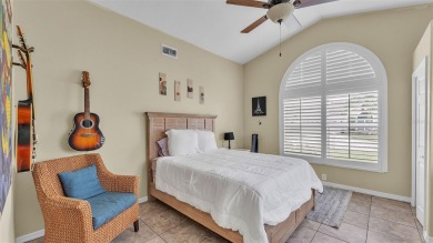 Enjoy peaceful golf course and water views from this 2-bedroom on Imperial Lakes Country Club in Florida - for sale on GolfHomes.com, golf home, golf lot