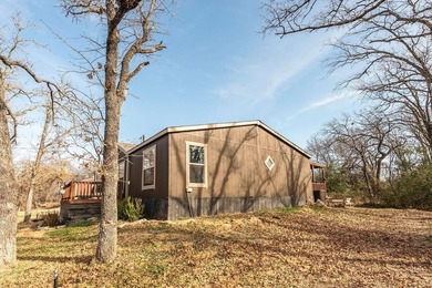 Beautiful home located on a quiet street at the back of a on Nocona Hills Golf Course in Texas - for sale on GolfHomes.com, golf home, golf lot