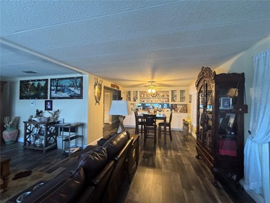 Welcome to a sought-after 55+ golf course community! This on Zellwood Station Country Club in Florida - for sale on GolfHomes.com, golf home, golf lot