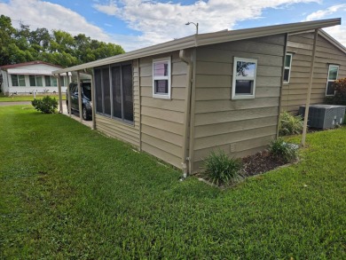 This meticulously maintained 1983 Barr 2bd 2ba home has been on Grasslands Golf and Country Club in Florida - for sale on GolfHomes.com, golf home, golf lot