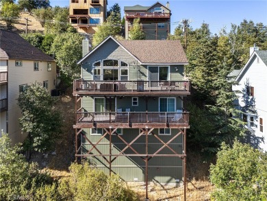 Nestled in the serene Lake Arrowhead woods, this stunning 3,040 on Lake Arrowhead Country Club in California - for sale on GolfHomes.com, golf home, golf lot