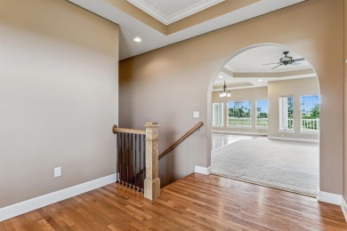 Situated on hole #4 at River Ridge Golf Course, this stunning on River Ridge Golf Club in Iowa - for sale on GolfHomes.com, golf home, golf lot