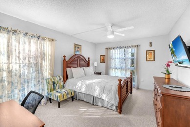 Spacious 3-bedroom, 2-bath corner unit located on the top floor on Woodlands Country Club in Florida - for sale on GolfHomes.com, golf home, golf lot