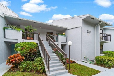 This home is nestled in the active gated community of Boca on Boca Delray Golf and Country Club in Florida - for sale on GolfHomes.com, golf home, golf lot