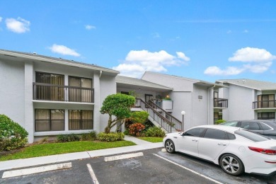 This home is nestled in the active gated community of Boca on Boca Delray Golf and Country Club in Florida - for sale on GolfHomes.com, golf home, golf lot