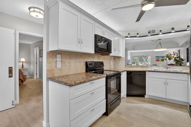 STUNNING FULLY RENOVATED 2 BEDROOM 2 BATH CONDO BOASTING 1800 SQ on  in Florida - for sale on GolfHomes.com, golf home, golf lot