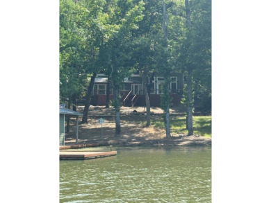 Wonderful modern style home in the piney woods of east Texas on Pine Dunes Golf Course in Texas - for sale on GolfHomes.com, golf home, golf lot