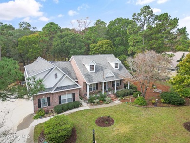This beautiful home is nestled on a completely landscaped wooded on Lockwood Folly Country Club in North Carolina - for sale on GolfHomes.com, golf home, golf lot