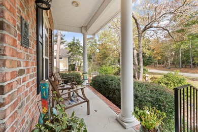 This beautiful home is nestled on a completely landscaped wooded on Lockwood Folly Country Club in North Carolina - for sale on GolfHomes.com, golf home, golf lot