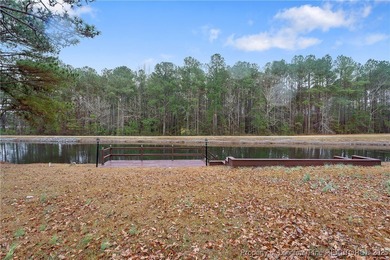 Embrace the beauty of Lake life in this charming 3 bedroom,2 on Carolina Lakes Country Club in North Carolina - for sale on GolfHomes.com, golf home, golf lot