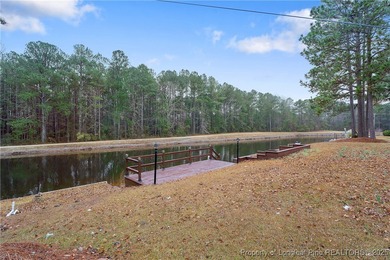 Embrace the beauty of Lake life in this charming 3 bedroom,2 on Carolina Lakes Country Club in North Carolina - for sale on GolfHomes.com, golf home, golf lot