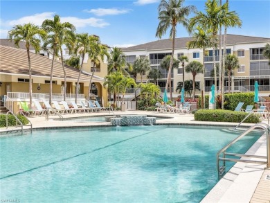 3bd 2 ba end unit condo, with a beautiful lake view. Condo has on Club at Pelican Bay Golf Course in Florida - for sale on GolfHomes.com, golf home, golf lot