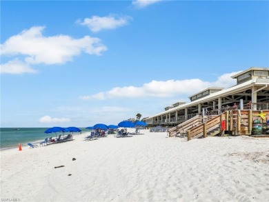 3bd 2 ba end unit condo, with a beautiful lake view. Condo has on Club at Pelican Bay Golf Course in Florida - for sale on GolfHomes.com, golf home, golf lot