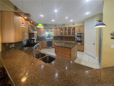 Crane Creek Fortress - Step inside this stunning CBS sanctuary on Martin Downs Country Club in Florida - for sale on GolfHomes.com, golf home, golf lot