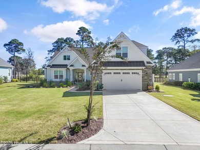 This open and airy home with golf and pond views is ready for a on Sea Trail Golf Resort in North Carolina - for sale on GolfHomes.com, golf home, golf lot