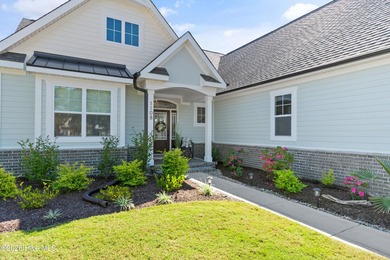 This open and airy home with golf and pond views is ready for a on Sea Trail Golf Resort in North Carolina - for sale on GolfHomes.com, golf home, golf lot