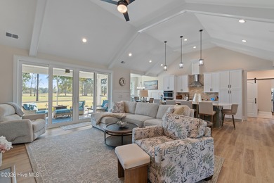 This open and airy home with golf and pond views is ready for a on Sea Trail Golf Resort in North Carolina - for sale on GolfHomes.com, golf home, golf lot