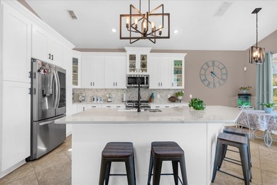 Experience golf course living at its finest in this beautifully on Hunters Creek Golf Course in Florida - for sale on GolfHomes.com, golf home, golf lot