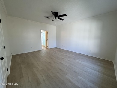 Welcome home to this recently updated 3-bedroom, 2-bath brick on Diamondhead Country Club in Mississippi - for sale on GolfHomes.com, golf home, golf lot