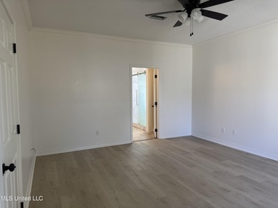 Welcome home to this recently updated 3-bedroom, 2-bath brick on Diamondhead Country Club in Mississippi - for sale on GolfHomes.com, golf home, golf lot