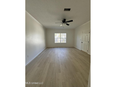 Welcome home to this recently updated 3-bedroom, 2-bath brick on Diamondhead Country Club in Mississippi - for sale on GolfHomes.com, golf home, golf lot