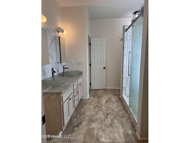 Welcome home to this recently updated 3-bedroom, 2-bath brick on Diamondhead Country Club in Mississippi - for sale on GolfHomes.com, golf home, golf lot