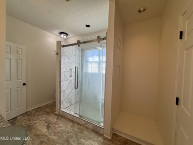 Welcome home to this recently updated 3-bedroom, 2-bath brick on Diamondhead Country Club in Mississippi - for sale on GolfHomes.com, golf home, golf lot