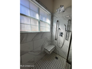 Welcome home to this recently updated 3-bedroom, 2-bath brick on Diamondhead Country Club in Mississippi - for sale on GolfHomes.com, golf home, golf lot