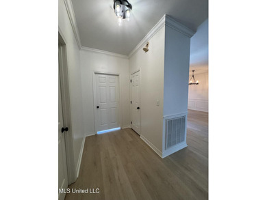 Welcome home to this recently updated 3-bedroom, 2-bath brick on Diamondhead Country Club in Mississippi - for sale on GolfHomes.com, golf home, golf lot