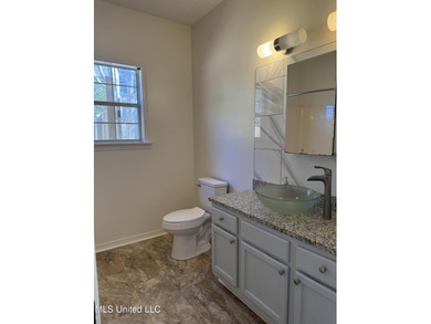 Welcome home to this recently updated 3-bedroom, 2-bath brick on Diamondhead Country Club in Mississippi - for sale on GolfHomes.com, golf home, golf lot