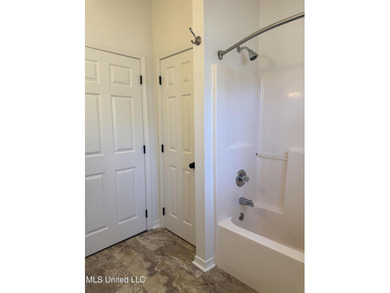 Welcome home to this recently updated 3-bedroom, 2-bath brick on Diamondhead Country Club in Mississippi - for sale on GolfHomes.com, golf home, golf lot