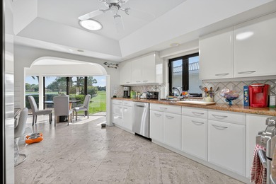 A spectaculate view awaits you as you enter this bright, airy on Eastpointe Country Club in Florida - for sale on GolfHomes.com, golf home, golf lot