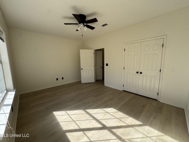 Welcome home to this recently updated 3-bedroom, 2-bath brick on Diamondhead Country Club in Mississippi - for sale on GolfHomes.com, golf home, golf lot