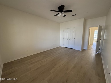 Welcome home to this recently updated 3-bedroom, 2-bath brick on Diamondhead Country Club in Mississippi - for sale on GolfHomes.com, golf home, golf lot