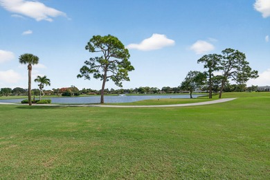 A spectaculate view awaits you as you enter this bright, airy on Eastpointe Country Club in Florida - for sale on GolfHomes.com, golf home, golf lot