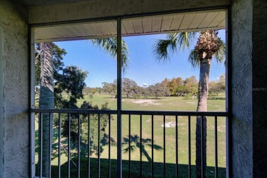 Beautifully RENOVATED second floor unit with GOLF COURSE views on The Dunedin Country Club in Florida - for sale on GolfHomes.com, golf home, golf lot