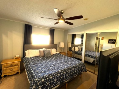 Discover your ideal retreat with this meticulously designed on Lake Henry Golf Club in Florida - for sale on GolfHomes.com, golf home, golf lot