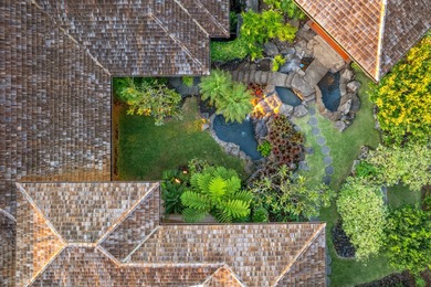 Spanning 4,146 sf of living space with 6,270 sf under roof, this on Club At Hokulia in Hawaii - for sale on GolfHomes.com, golf home, golf lot