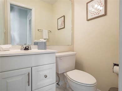 Sweeping golf views from this pied-a-terre in prestigious on Oak Harbor Country Club in Florida - for sale on GolfHomes.com, golf home, golf lot