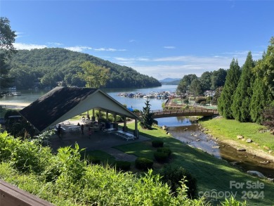 Enjoy a peaceful and scenic wooded setting on 2.77 acres, with on Rumbling Bald Resort on Lake Lure in North Carolina - for sale on GolfHomes.com, golf home, golf lot